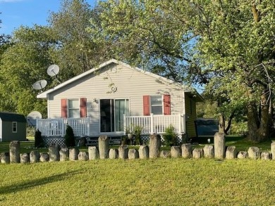 Cozy cottage with open floor plan and beachy feel.  Fully on Captains Cove Golf and Yacht Club in Virginia - for sale on GolfHomes.com, golf home, golf lot