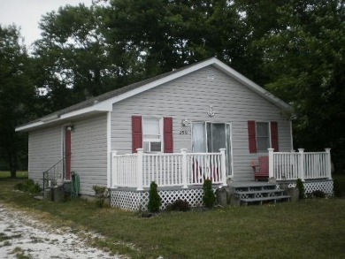 Cozy cottage with open floor plan and beachy feel.  Fully on Captains Cove Golf and Yacht Club in Virginia - for sale on GolfHomes.com, golf home, golf lot