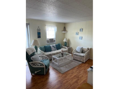 Cozy cottage with open floor plan and beachy feel.  Fully on Captains Cove Golf and Yacht Club in Virginia - for sale on GolfHomes.com, golf home, golf lot