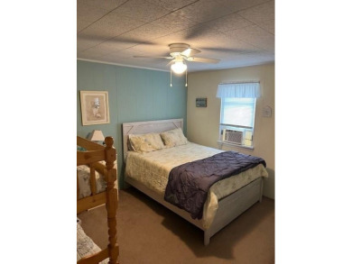 Cozy cottage with open floor plan and beachy feel.  Fully on Captains Cove Golf and Yacht Club in Virginia - for sale on GolfHomes.com, golf home, golf lot