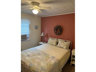 Cozy cottage with open floor plan and beachy feel.  Fully on Captains Cove Golf and Yacht Club in Virginia - for sale on GolfHomes.com, golf home, golf lot