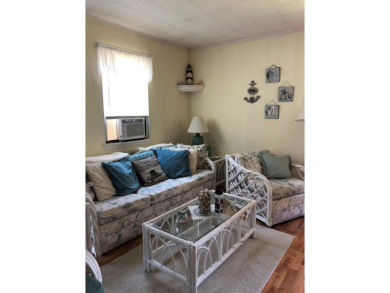 Cozy cottage with open floor plan and beachy feel.  Fully on Captains Cove Golf and Yacht Club in Virginia - for sale on GolfHomes.com, golf home, golf lot