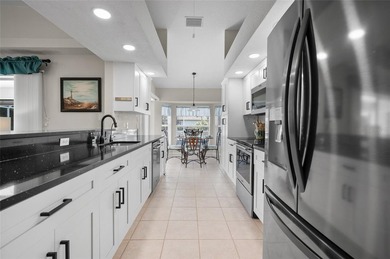 Step into refreshed Florida living in this beautifully updated on Pinemoor West Golf Club in Florida - for sale on GolfHomes.com, golf home, golf lot