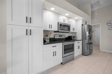 Step into refreshed Florida living in this beautifully updated on Pinemoor West Golf Club in Florida - for sale on GolfHomes.com, golf home, golf lot