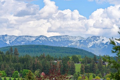 If you want beautiful Swan Mountain views from almost every room on  in Montana - for sale on GolfHomes.com, golf home, golf lot
