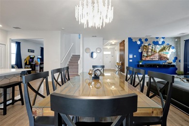 This exceptional ChampionsGate Retreat POOL home showcases on The Oasis Club at Champions Gate in Florida - for sale on GolfHomes.com, golf home, golf lot