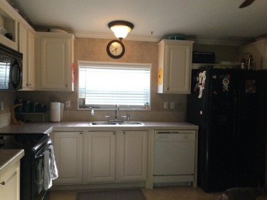 Move right into this beautifully updated home tucked back into a on Spanish Lakes I in Florida - for sale on GolfHomes.com, golf home, golf lot