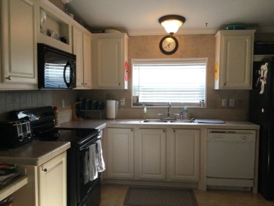 Move right into this beautifully updated home tucked back into a on Spanish Lakes I in Florida - for sale on GolfHomes.com, golf home, golf lot