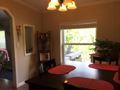 Move right into this beautifully updated home tucked back into a on Spanish Lakes I in Florida - for sale on GolfHomes.com, golf home, golf lot