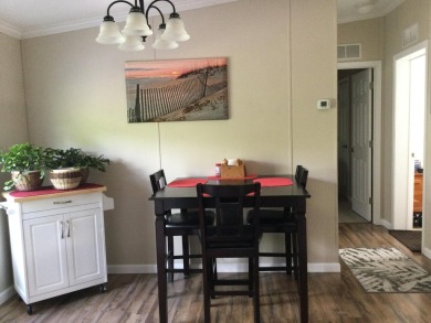 Move right into this beautifully updated home tucked back into a on Spanish Lakes I in Florida - for sale on GolfHomes.com, golf home, golf lot