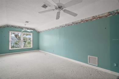 ENTIRE FIRST FLOOR HAS BEEN FRESHLY PAINTED IN A NEUTRAL COLOR on Country Club of Mount Dora in Florida - for sale on GolfHomes.com, golf home, golf lot