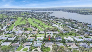 THIS SPACIOUS 4 BEDROOM/2 BATH HOME WITH A LARGE SCREENED IN on Tequesta Country Club in Florida - for sale on GolfHomes.com, golf home, golf lot