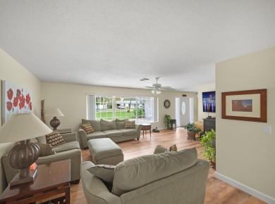 THIS SPACIOUS 4 BEDROOM/2 BATH HOME WITH A LARGE SCREENED IN on Tequesta Country Club in Florida - for sale on GolfHomes.com, golf home, golf lot