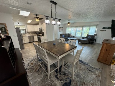 This home is set up to enjoy the Florida lifestyle! This on Lake Henry Golf Club in Florida - for sale on GolfHomes.com, golf home, golf lot