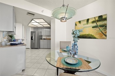 Lush tropical and water views await from this 12th floor condo on Pasadena Yacht and Country Club in Florida - for sale on GolfHomes.com, golf home, golf lot