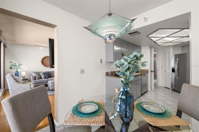 Lush tropical and water views await from this 12th floor condo on Pasadena Yacht and Country Club in Florida - for sale on GolfHomes.com, golf home, golf lot
