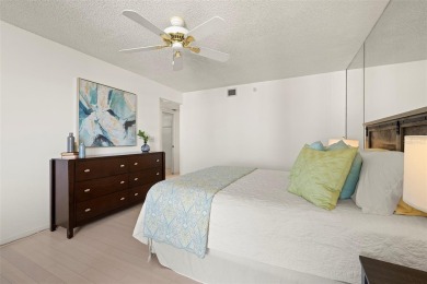Lush tropical and water views await from this 12th floor condo on Pasadena Yacht and Country Club in Florida - for sale on GolfHomes.com, golf home, golf lot