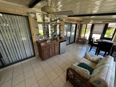 This home is set up to enjoy the Florida lifestyle! This on Lake Henry Golf Club in Florida - for sale on GolfHomes.com, golf home, golf lot