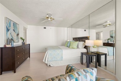Lush tropical and water views await from this 12th floor condo on Pasadena Yacht and Country Club in Florida - for sale on GolfHomes.com, golf home, golf lot