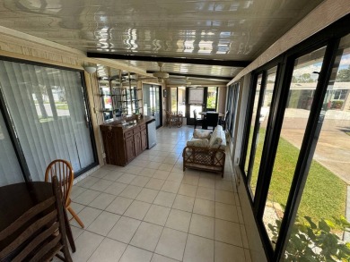 This home is set up to enjoy the Florida lifestyle! This on Lake Henry Golf Club in Florida - for sale on GolfHomes.com, golf home, golf lot