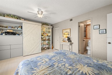 Lush tropical and water views await from this 12th floor condo on Pasadena Yacht and Country Club in Florida - for sale on GolfHomes.com, golf home, golf lot