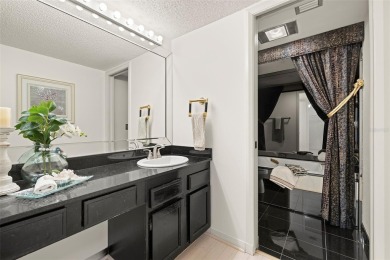 Lush tropical and water views await from this 12th floor condo on Pasadena Yacht and Country Club in Florida - for sale on GolfHomes.com, golf home, golf lot