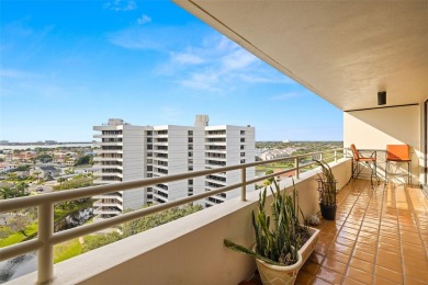 Lush tropical and water views await from this 12th floor condo on Pasadena Yacht and Country Club in Florida - for sale on GolfHomes.com, golf home, golf lot