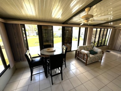 This home is set up to enjoy the Florida lifestyle! This on Lake Henry Golf Club in Florida - for sale on GolfHomes.com, golf home, golf lot