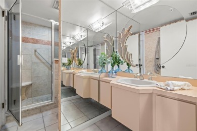 Lush tropical and water views await from this 12th floor condo on Pasadena Yacht and Country Club in Florida - for sale on GolfHomes.com, golf home, golf lot