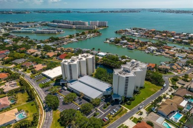 Lush tropical and water views await from this 12th floor condo on Pasadena Yacht and Country Club in Florida - for sale on GolfHomes.com, golf home, golf lot