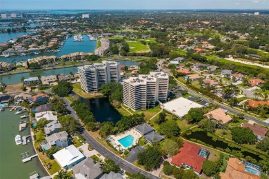 Lush tropical and water views await from this 12th floor condo on Pasadena Yacht and Country Club in Florida - for sale on GolfHomes.com, golf home, golf lot