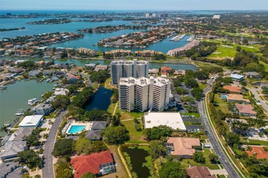 Lush tropical and water views await from this 12th floor condo on Pasadena Yacht and Country Club in Florida - for sale on GolfHomes.com, golf home, golf lot