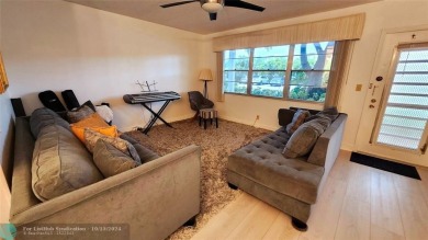 This charming 1 bedroom, 1.5 bathroom residence in Century on Hillsboro Pines Golf in Florida - for sale on GolfHomes.com, golf home, golf lot