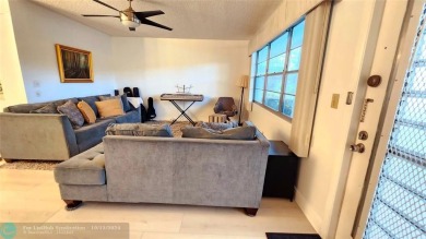 This charming 1 bedroom, 1.5 bathroom residence in Century on Hillsboro Pines Golf in Florida - for sale on GolfHomes.com, golf home, golf lot