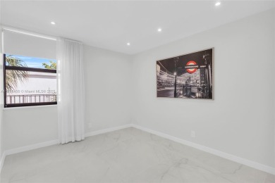 Step into modern elegance with this beautifully renovated on Turnberry Isle Resort and Club in Florida - for sale on GolfHomes.com, golf home, golf lot