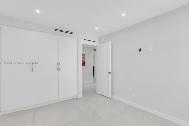 Step into modern elegance with this beautifully renovated on Turnberry Isle Resort and Club in Florida - for sale on GolfHomes.com, golf home, golf lot