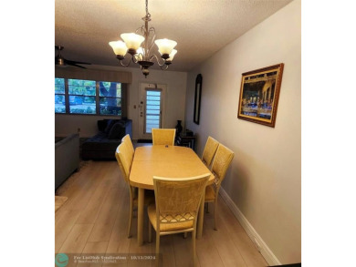 This charming 1 bedroom, 1.5 bathroom residence in Century on Hillsboro Pines Golf in Florida - for sale on GolfHomes.com, golf home, golf lot