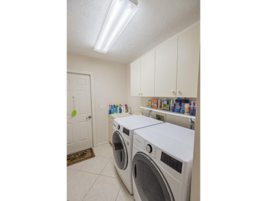 Welcome to this stunning 3/2/2 pool home nestled in sought after on St. Lucie Trail Golf Club in Florida - for sale on GolfHomes.com, golf home, golf lot