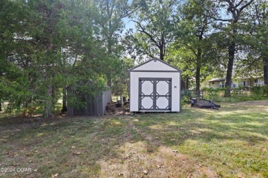 Discover the charm of Briarbrook in this delightful 3-bedroom on Briarbrook Golf Course in Missouri - for sale on GolfHomes.com, golf home, golf lot