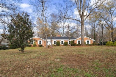 Welcome to this beautiful brick ranch with a walkout basement on Oak Hills Golf and Event Center in North Carolina - for sale on GolfHomes.com, golf home, golf lot