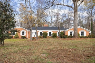 Welcome to this beautiful brick ranch with a walkout basement on Oak Hills Golf and Event Center in North Carolina - for sale on GolfHomes.com, golf home, golf lot