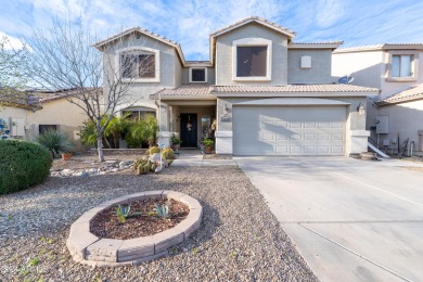 This two-story home boasts a beautifully landscaped backyard on Las Colinas Golf Club in Arizona - for sale on GolfHomes.com, golf home, golf lot