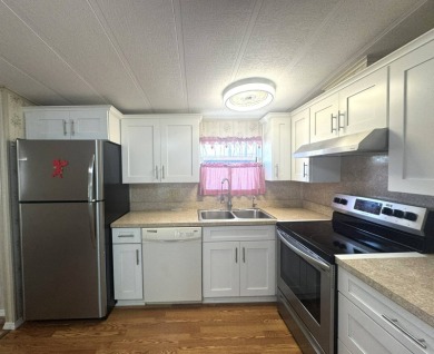 Nicely updated home with newer kitchen appliances, washer/dryer on Golden Lakes Golf Course in Florida - for sale on GolfHomes.com, golf home, golf lot