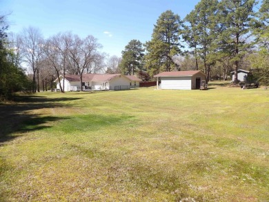 LOCATED ACROSS STREET FROM GREERS FERRY LAKE AND CENTRALLY on Thunderbird Country Club in Arkansas - for sale on GolfHomes.com, golf home, golf lot