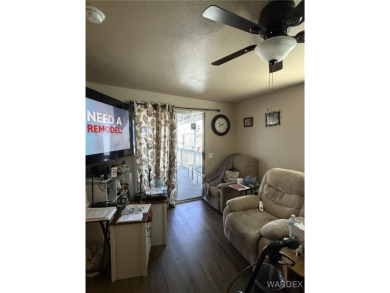 Charming home with versatile Arizona room has a completely on Riverview Golf Course in Arizona - for sale on GolfHomes.com, golf home, golf lot