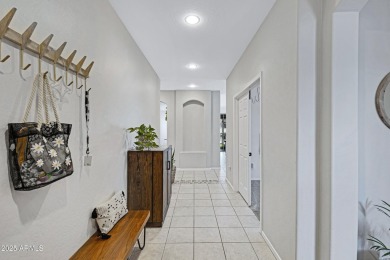 This delightful single-story residence offers 3 spacious on The Golf Club At Johnson Ranch in Arizona - for sale on GolfHomes.com, golf home, golf lot