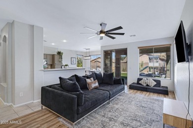 This delightful single-story residence offers 3 spacious on The Golf Club At Johnson Ranch in Arizona - for sale on GolfHomes.com, golf home, golf lot