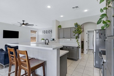 This delightful single-story residence offers 3 spacious on The Golf Club At Johnson Ranch in Arizona - for sale on GolfHomes.com, golf home, golf lot