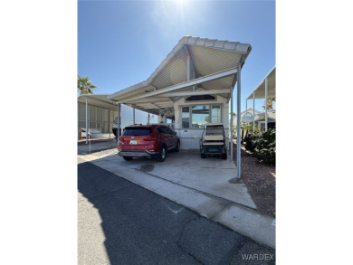 Charming home with versatile Arizona room has a completely on Riverview Golf Course in Arizona - for sale on GolfHomes.com, golf home, golf lot