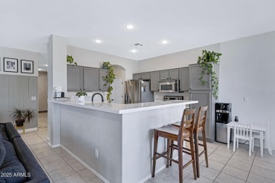 This delightful single-story residence offers 3 spacious on The Golf Club At Johnson Ranch in Arizona - for sale on GolfHomes.com, golf home, golf lot